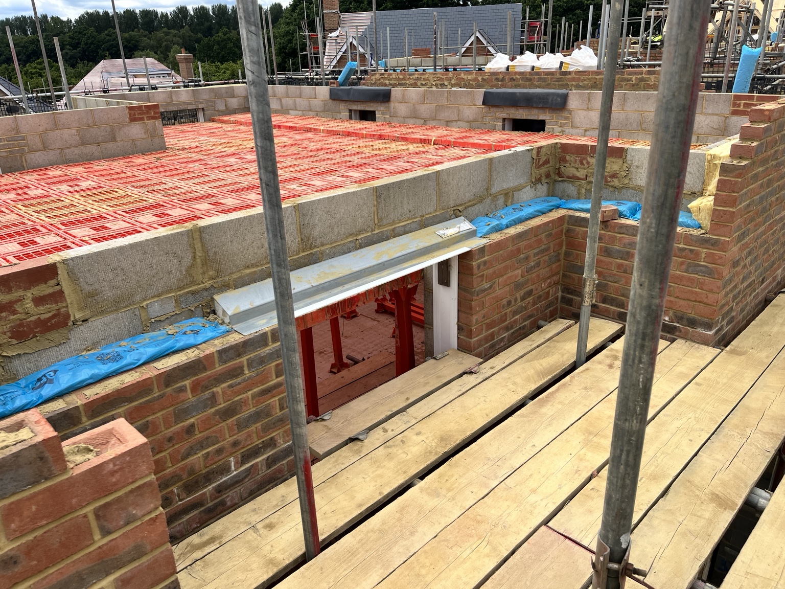 Brickwork in progress on a domestic construction site